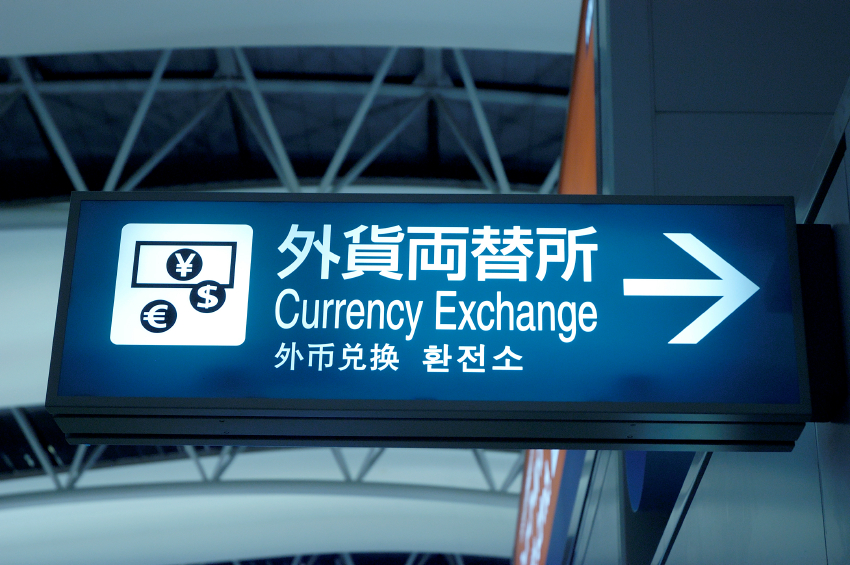 Currency exchange sign at Osaka Airport.
